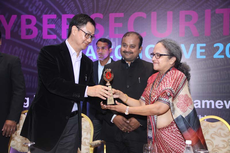 Shri. Kiren Rijiju, MoS for Home Affairs, Govt. of India felicitating Rama Vedashree, CEO, DSCI with a Memento