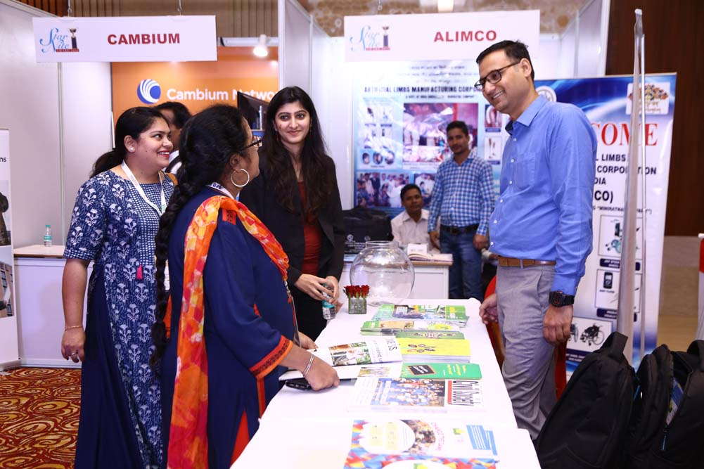 Visitors interacting at the Cambium Networks stall