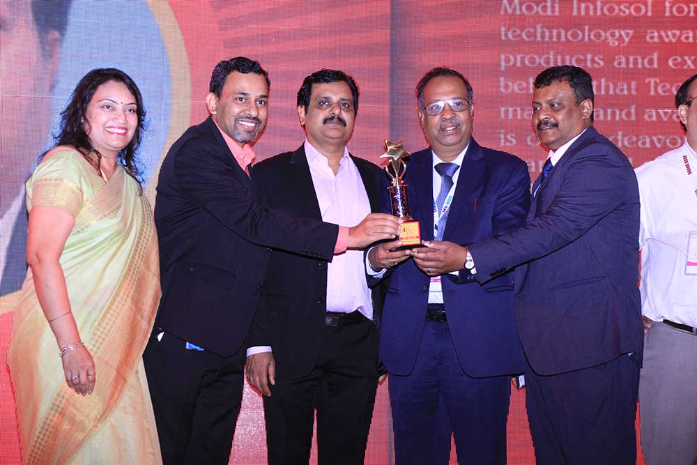 Modi Infosol receiving the award for the Best IT Service Provider at VAR Symposium - 17th Star Nite Awards 2018